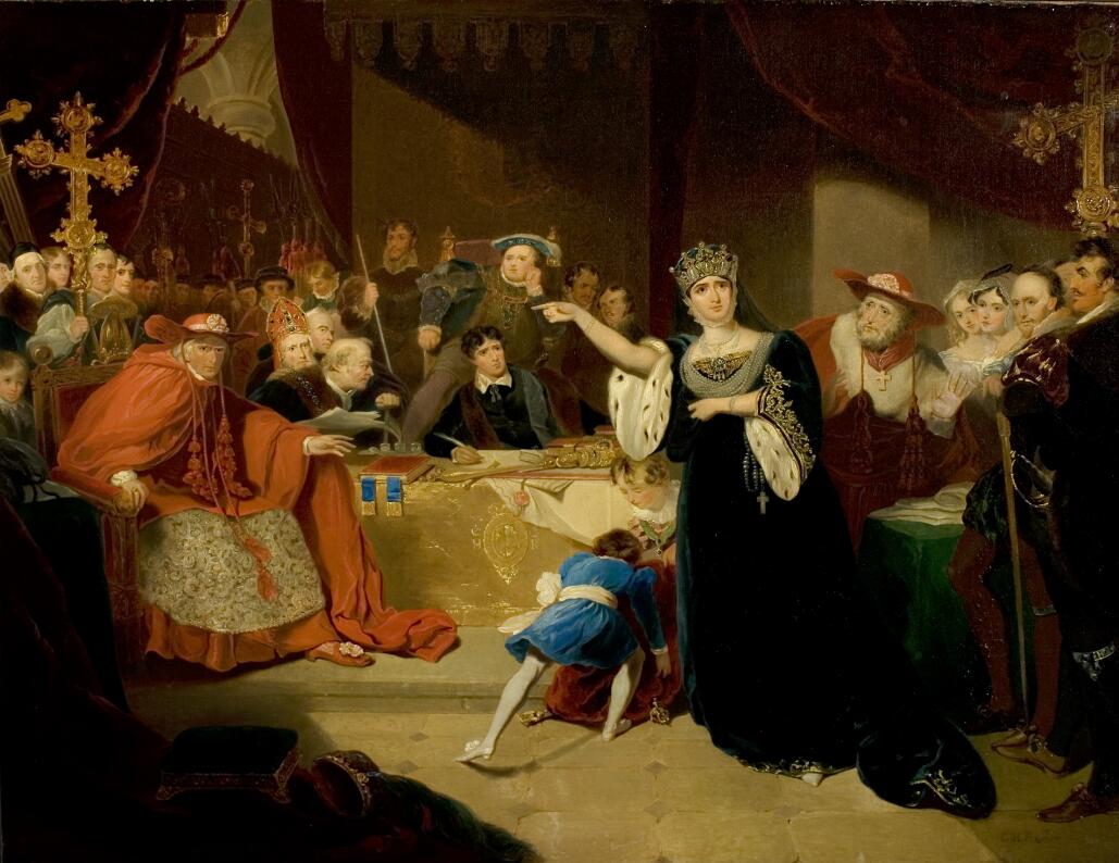 An oil painting of a crowded court scene. Queen Katherine of Aragon, wearing a crown and a dark green velvet gown with ermine-lined sleeves, stands just right of centre and points an accusatory finger at a seated man in a cardinal's red robes and broad-brimmed hat. Another cardinal hovers behind the queen, with one palm raised in apparent disagreement. In the centre of the foreground, two children are attempting to move a heavy red velvet bag or cushion. Behind them, a table spread with a gold cloth bears several books and papers and a gold sceptre. Thomas Cromwell is seated behind the table, in a black coat, white collar, and fur-lined robe, holding a quill pen. Behind him, King Henry VIII sits on an elevated throne; his cheek is propped on one hand, and he wears an elaborate doublet and hat with several chains of office. On both sides, more figures crowd into the background to watch the trial; some of them are dressed as bishops and holding crosiers. There is a  curtained canopy over the king's seat and red velvet curtains on both sides; a glimpse of a vaulted ceiling can be seen through a gap in the curtains.